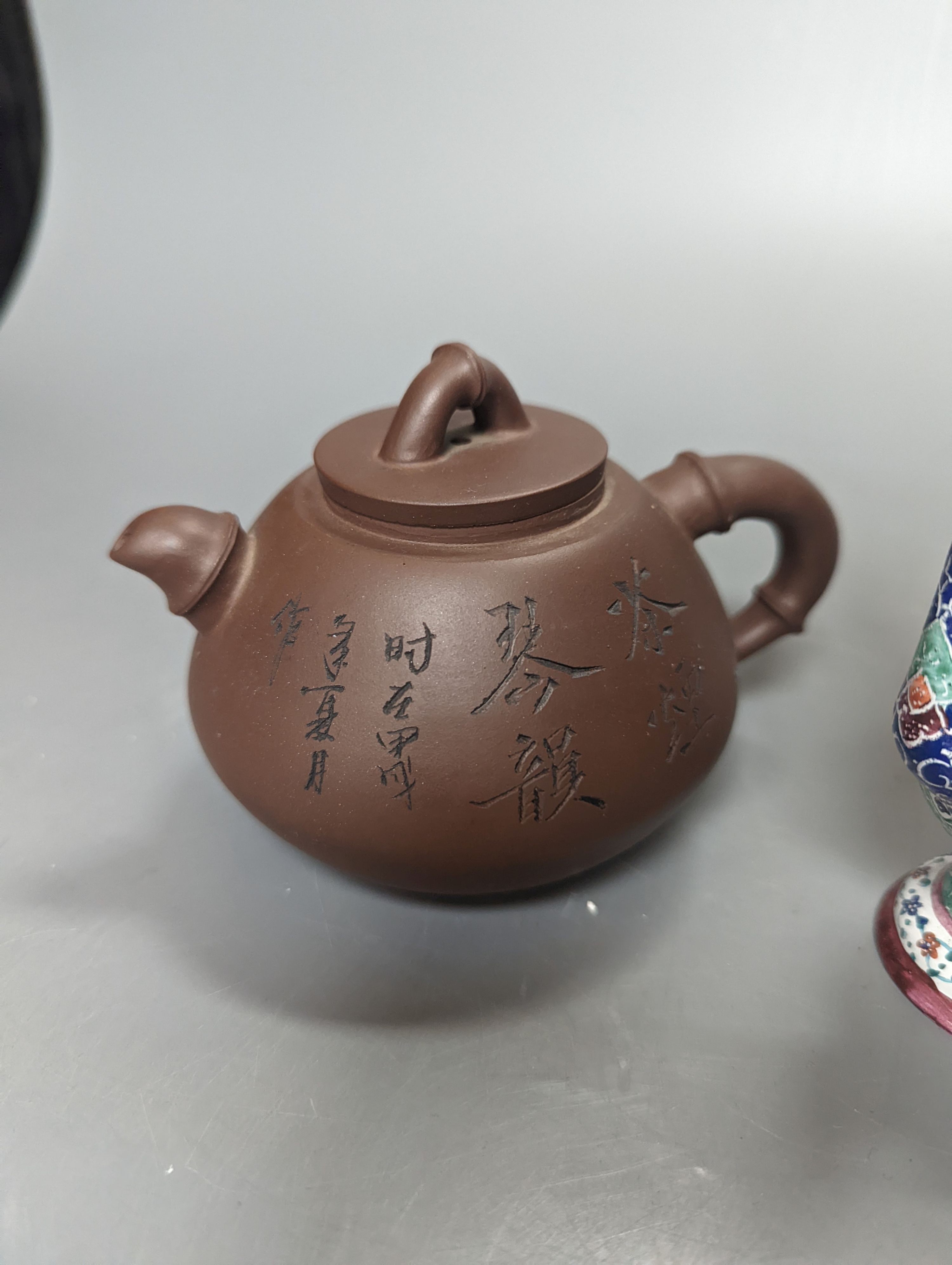 A Chinese Yixing teapot and a Isfahan enamel on copper ewer, 16.5cm high